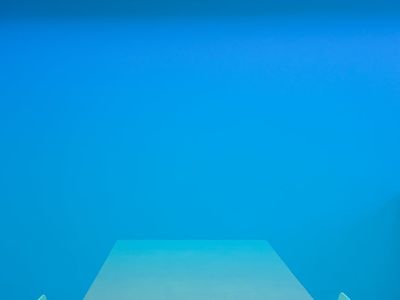 Minimalist fitness studio with neon cyan light accents